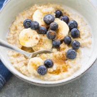 Instant pot steel cut oats with almond milk, maple syrup, cinnamon, banana and blueberries.