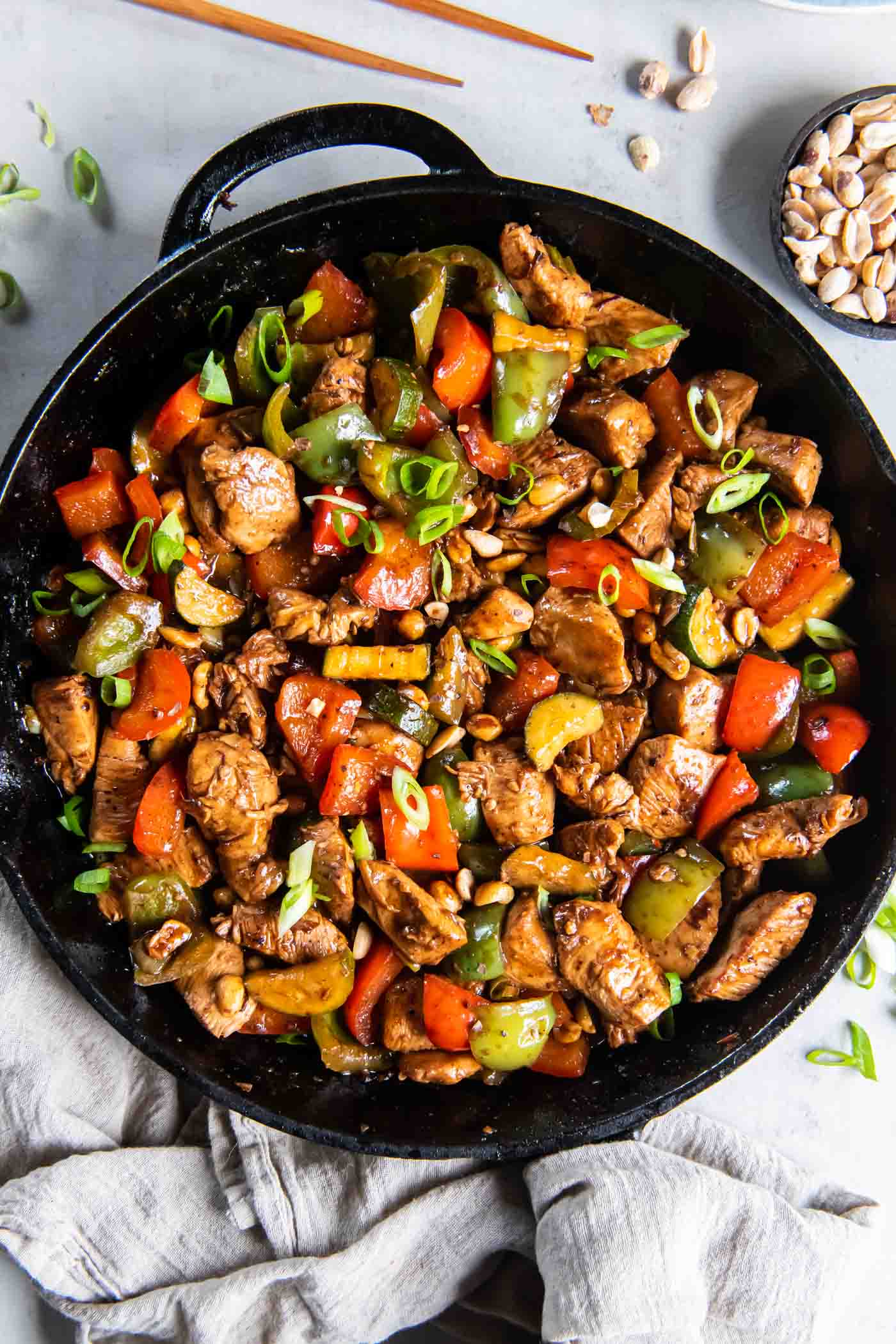 Kung Pao Chicken in a cast iron skillet.