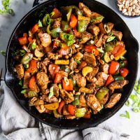 Kung pao chicken in a cast iron skillet.