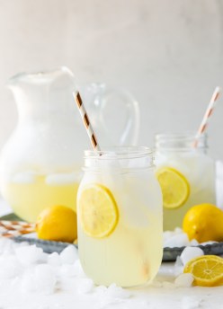 two glasses and a pitcher of homemade lemonade
