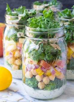 These easy vegetarian Mason Jar Broccoli Salads with Kale and Apple are a yummy make ahead lunch option! | www.kristineskitchenblog.com