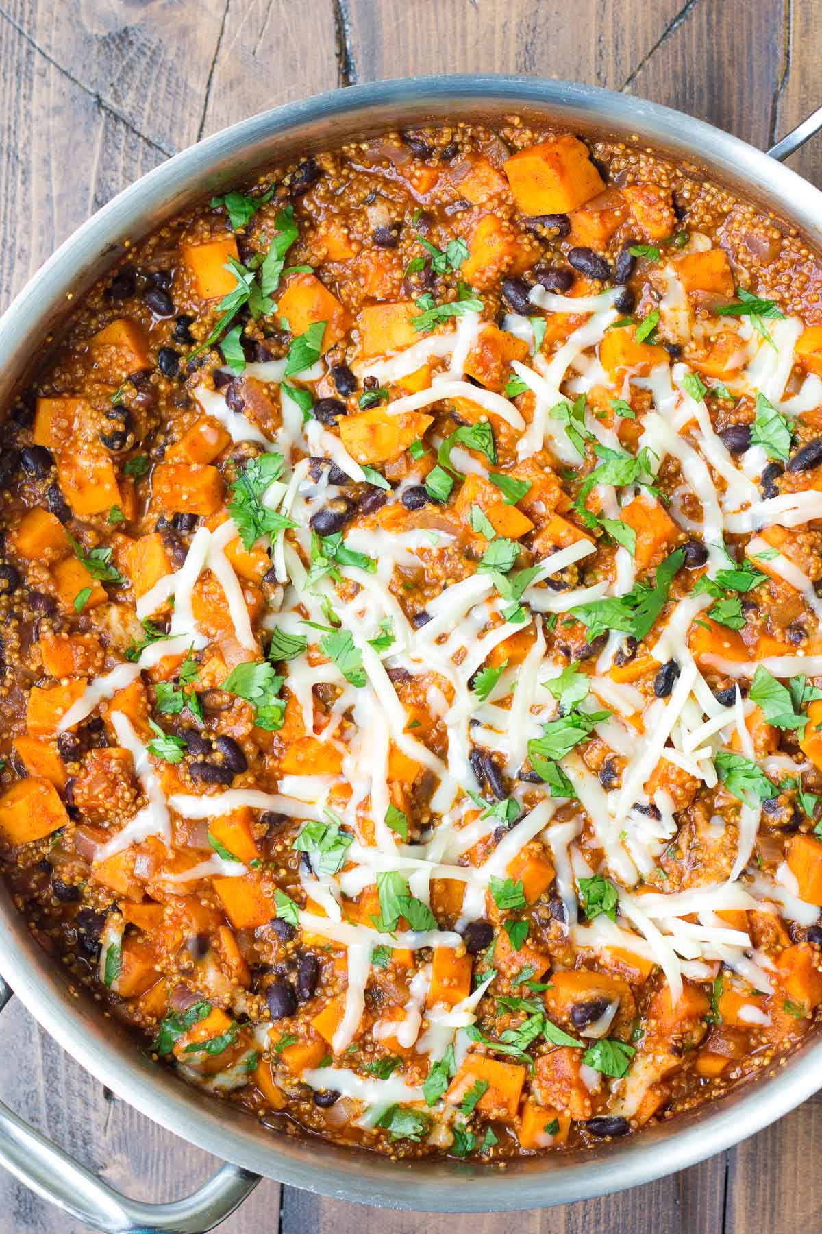 Mexican quinoa with sweet potatoes and black beans in a skillet