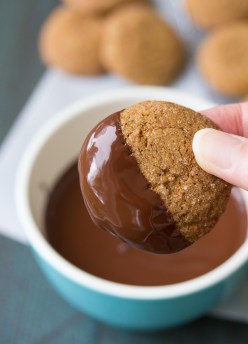 These soft and chewy molasses spice cookies are dipped in dark chocolate! They are a spiced Christmas cookie made with whole wheat flour and brown sugar.