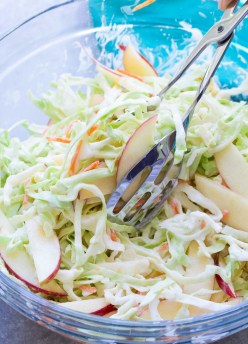 A creamy no mayo coleslaw made with Greek yogurt. This healthier coleslaw comes together in minutes and you'll love the addition of the sweet apple! | www.kristineskitchenblog.com