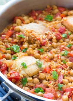 This One Pot Spanish Chickpea Chicken is an easy dinner recipe that the whole family will love! With brown rice, tomatoes, and vegetables, all cooked in one pan! | www.kristineskitchenblog.com