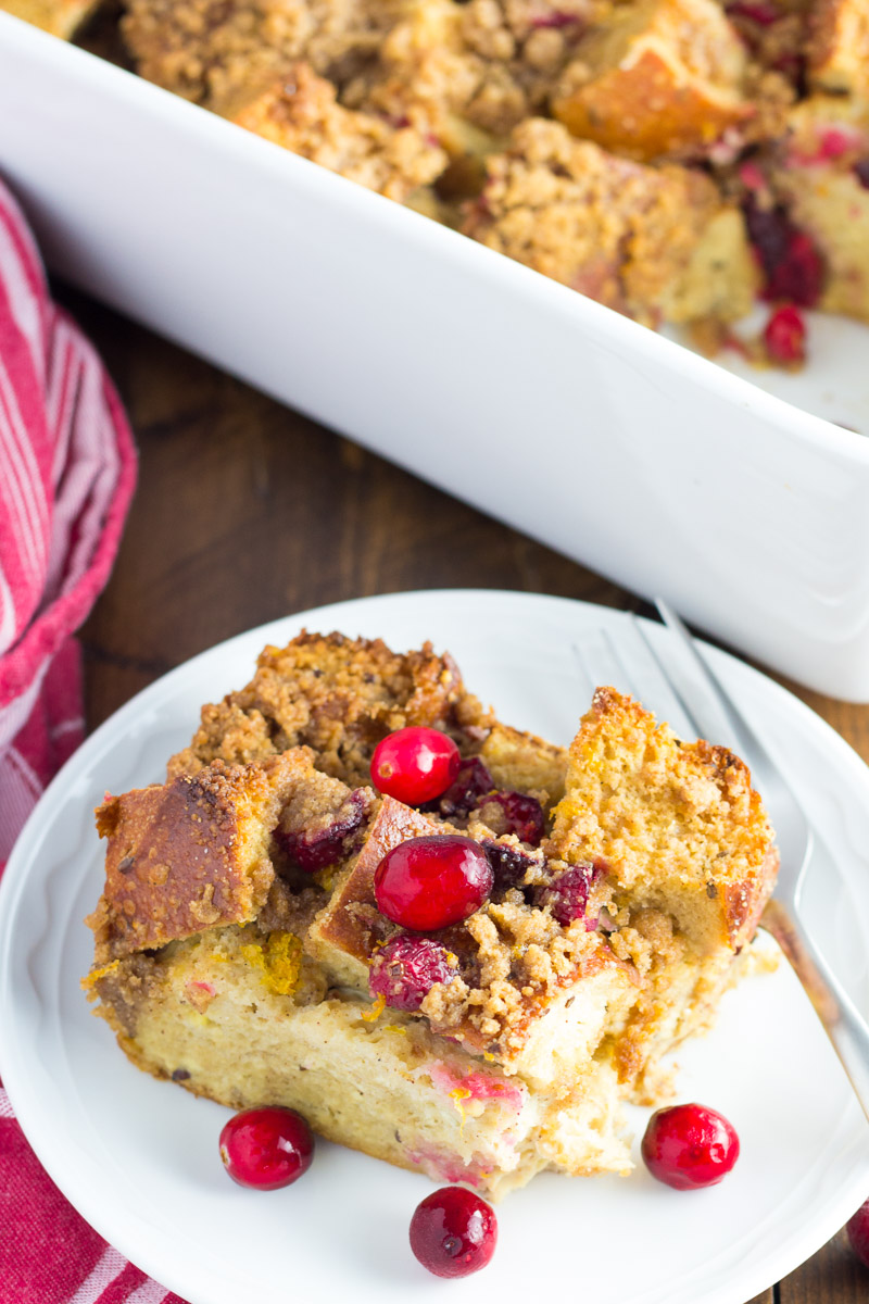 Slice of cranberry orange french toast casserole on a plate.