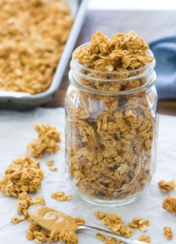 This peanut butter granola is made with just 4 ingredients, in only 10 minutes of prep time. It's crisp and lightly sweetened with honey, with the perfect peanut butter flavor. Make it for a quick breakfast or snack!