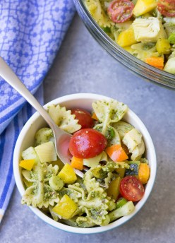 Make this colorful PESTO PASTA SALAD for your next BBQ or potluck! It's full of healthy vegetables all coated in a basil pesto sauce!