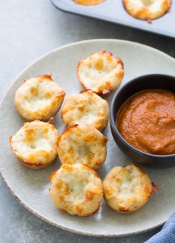 These Cheese Pizza Bites are a healthy lunch or snack for kids. Serve them with pizza sauce for dipping! This easy cheese pizza bites recipe is made with a quick no rise whole wheat pizza dough and mozzarella cheese.
