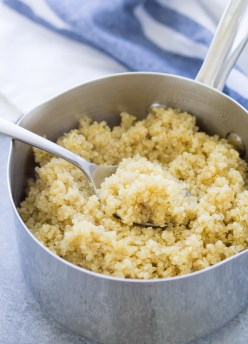 cooked quinoa in a pot with a spoon