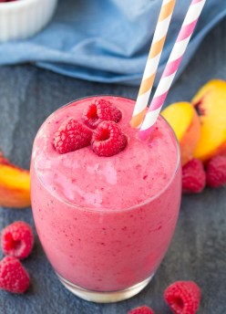 This Raspberry Peach Smoothie Shake is full of fresh raspberry flavor! With just a few ingredients, this vibrant smoothie is quick and easy to make!