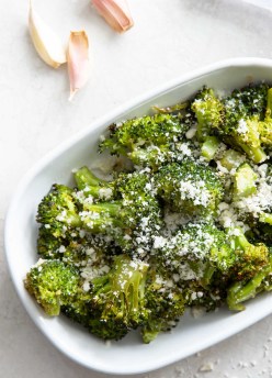 roasted broccoli with garlic and parmesan in a white dish
