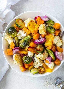Roasted vegetables in a white serving bowl.