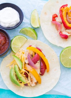 The best easy healthy crockpot chicken fajitas recipe! This simple fajita recipe has tender, juicy chicken and lots of flavor. The ingredients can be frozen and then cooked in your slow cooker!
