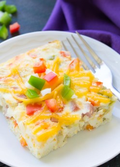 This Slow Cooker Ham, Cheese and Veggie Frittata is an easy make ahead breakfast! This crockpot egg casserole is also a great way to use up leftover ham. It’s like a Denver omelet!