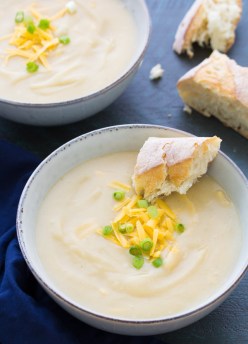 This Slow Cooker Potato Leek Soup with Cheddar is a comforting vegetarian meal. This soup is easy to make in your crock pot and the leftovers freeze well. This potato leek soup is incredibly smooth and creamy, yet it's made without cream. You can omit the cheese for a dairy-free version.