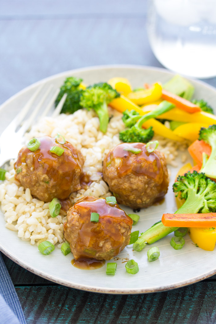 sweet and sour turkey meatballs served with rice and vegetables