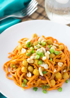 Sweet potato noodles with spicy peanut sauce and chickpeas. An easy one pot meal that's ready in 30 minutes! Your spiralizer makes this healthy, vegan, and gluten free dinner so quick and easy!