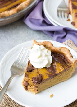 Swirled Chocolate Pumpkin Pie is our favorite Thanksgiving dessert! Make this healthier chocolate pumpkin pie for your holiday meal. Made with pure maple syrup, dark chocolate and a whole wheat crust. | www.kristineskitchenblog.com