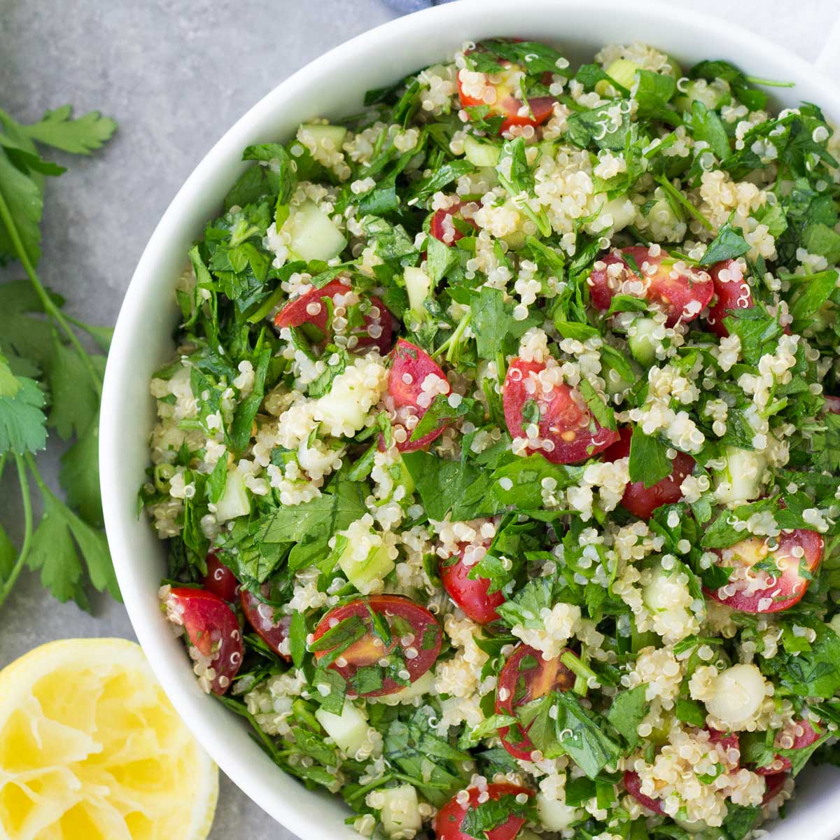 Tabouli (tabbouleh) served in a white bowl.