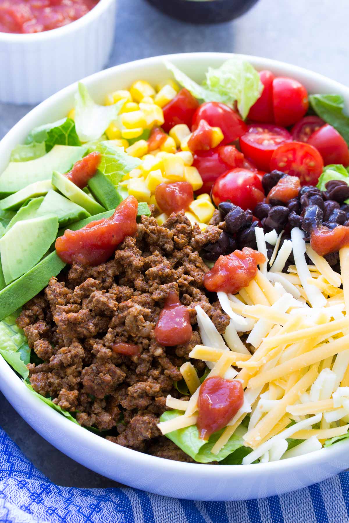 taco salad with ground beef served in a white bowl