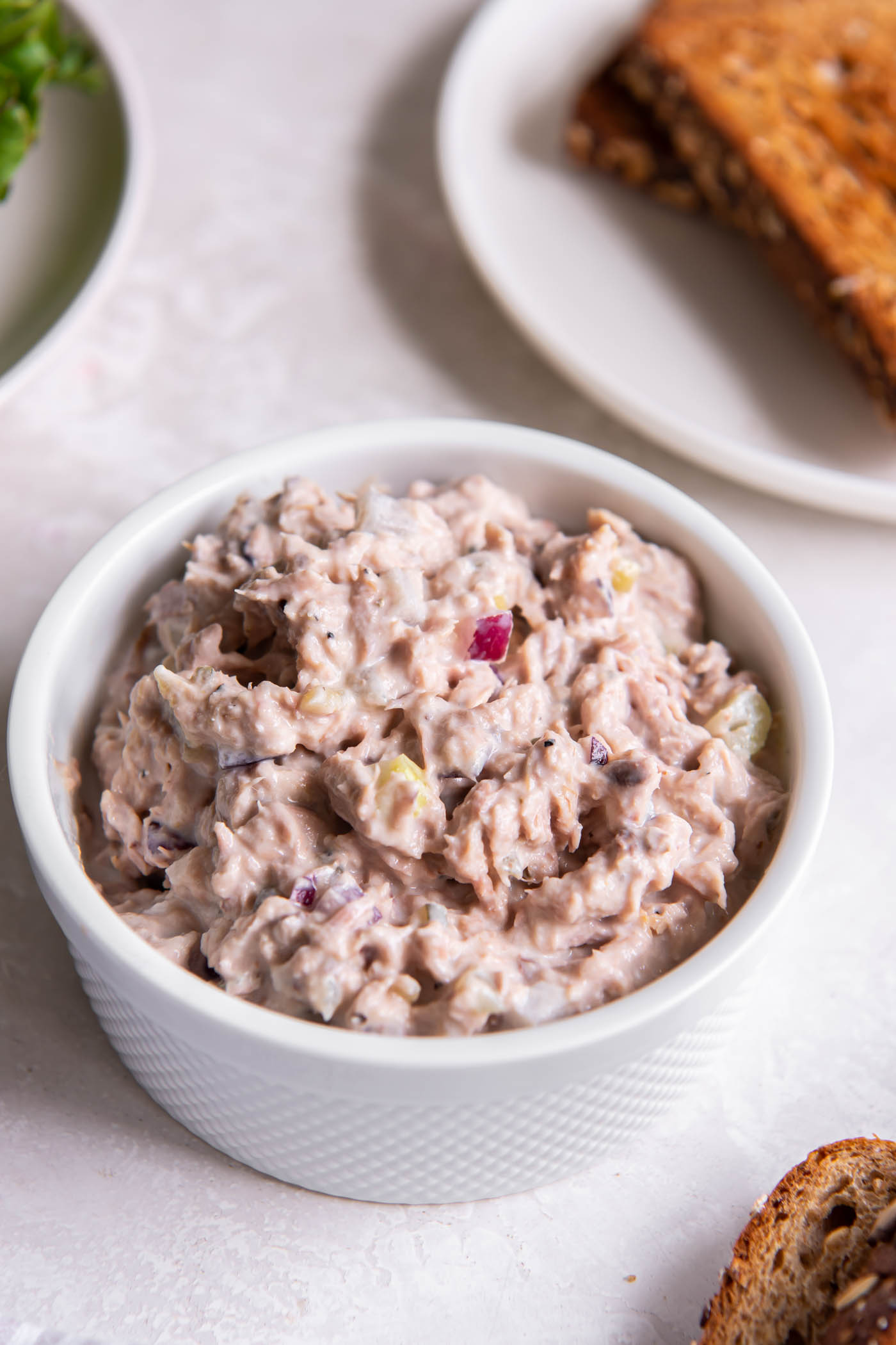 Tuna salad in a small white dish.