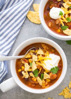 Turkey taco soup in a bowl with toppings.