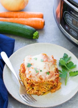 Your family will love eating their vegetables with this Veggie-Packed Slow Cooker Lasagna! This healthier lasagna is made with ground turkey and veggies. The veggies are shredded and chopped small so this is a kid-friendly dinner. You can make this easy slow cooker lasagna vegetarian.