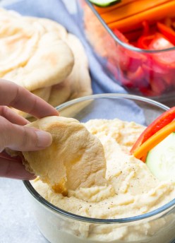 An easy recipe for homemade whole wheat pita bread, made with just a few pantry ingredients. You will love how soft and flavorful this pita bread is!